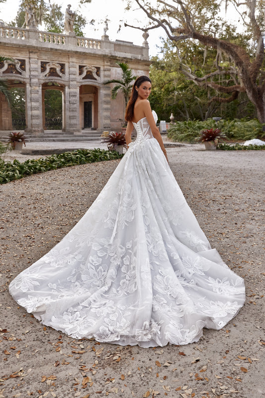 A-line wedding dress showcasing a stunning back view with an elegant train and floral lace detailing.