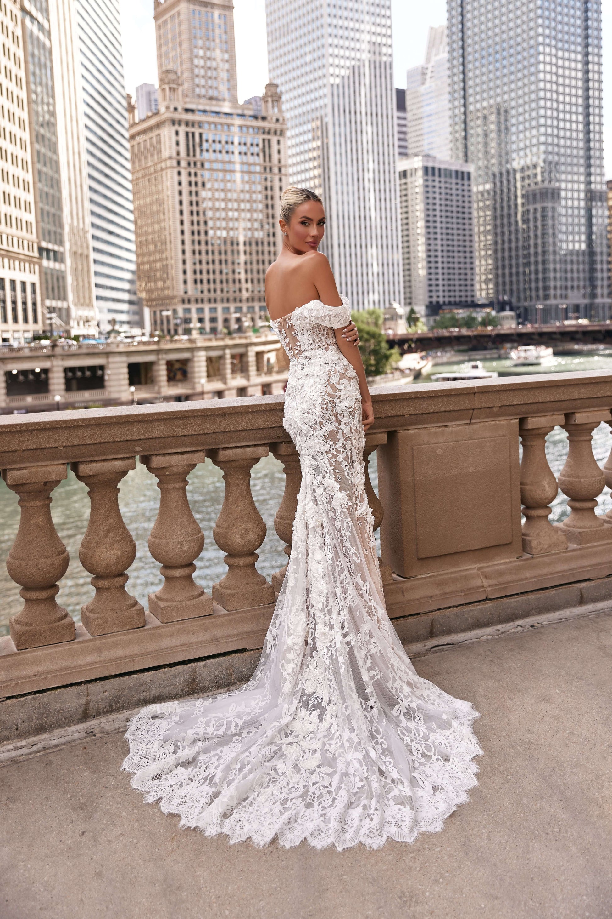 Chloe lined dress featuring a fitted silhouette and romantic lace detailing, worn by a model in an urban setting.