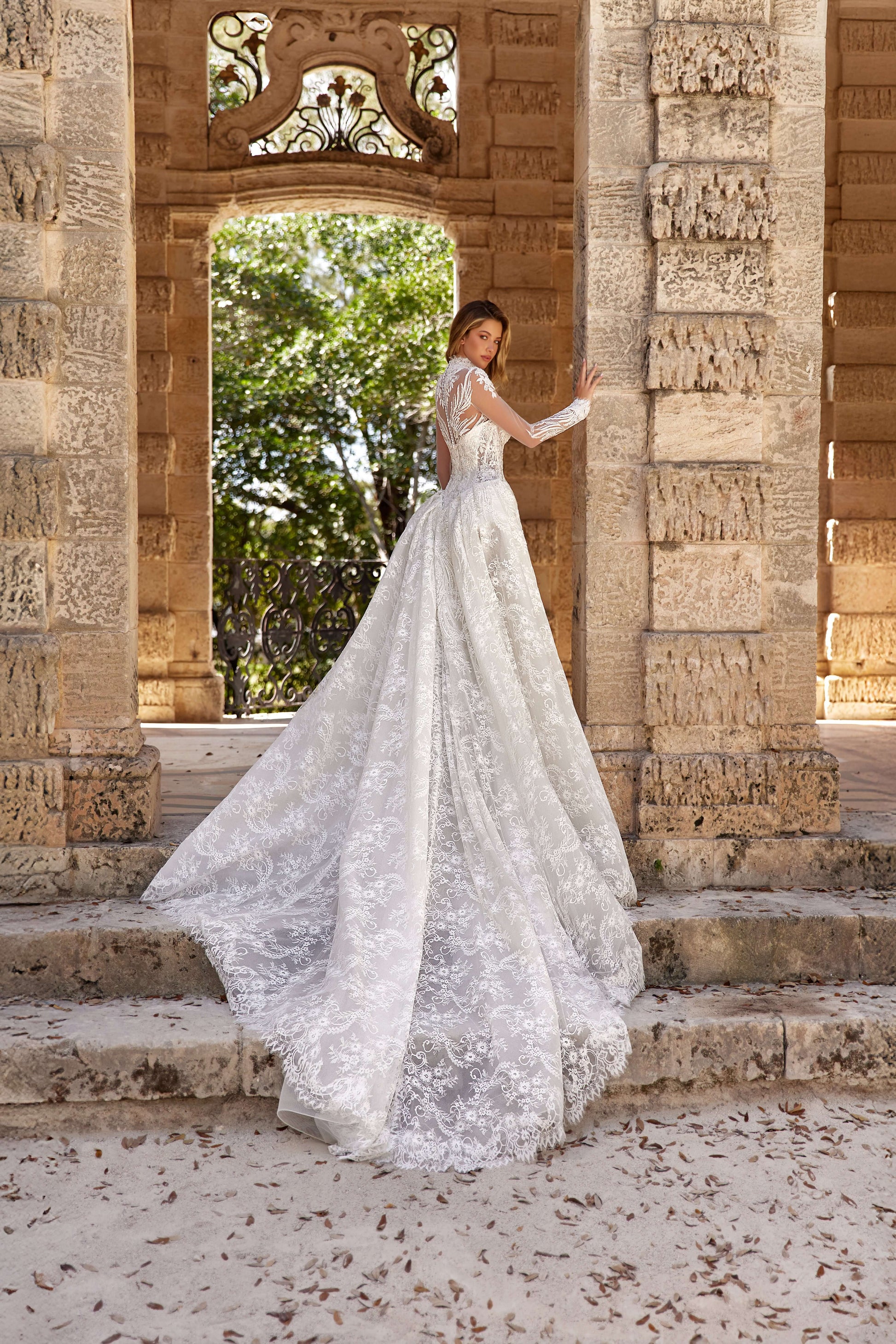 Stunning dress train silhouette featuring a two-in-one design, elegantly displayed outdoors.
