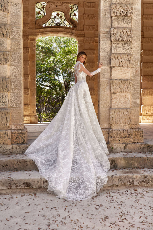 Stunning dress train silhouette featuring a two-in-one design, elegantly displayed outdoors.